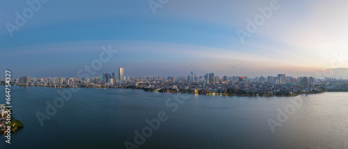 Hanoi skyline cityscape in Ho Tay West Lake with lake and city buildings