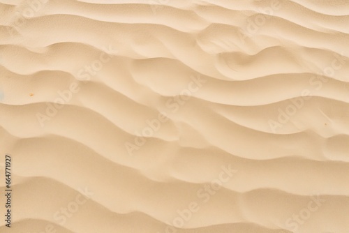 Closeup of sand pattern of a beach in the summer. © RABEYAAKTER