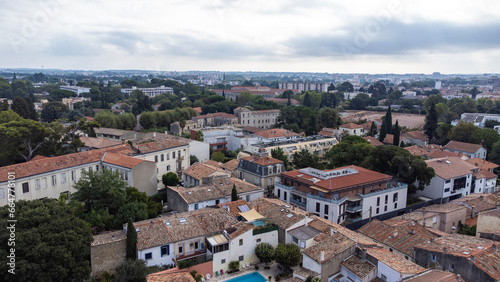 Aerial view over Montpellier. Trees pop out from the old stone buildings