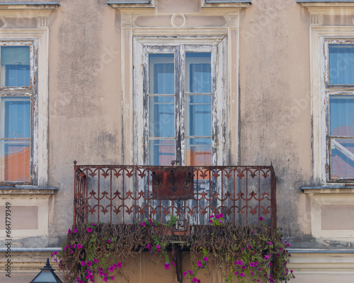 View of an old balcony decorated with flowers at the King Tomislav Square, Samobor, Croatia