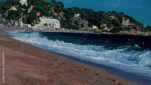 Sunset on the sea city beach in Lloret de Mar, Spain