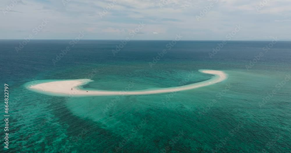 Aerial survey of sandbar with C formation in the middle of the sea in Camiguin Island. Philippines.