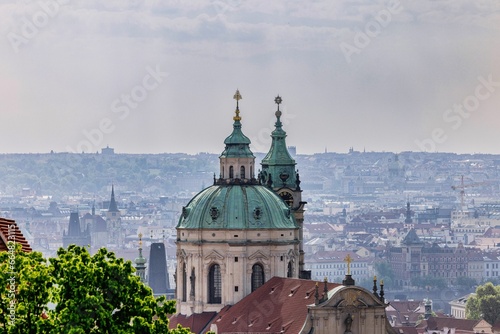 Photography Aerial view of Church of Saint Nicholas in Prague, Czech Republic with a citysca