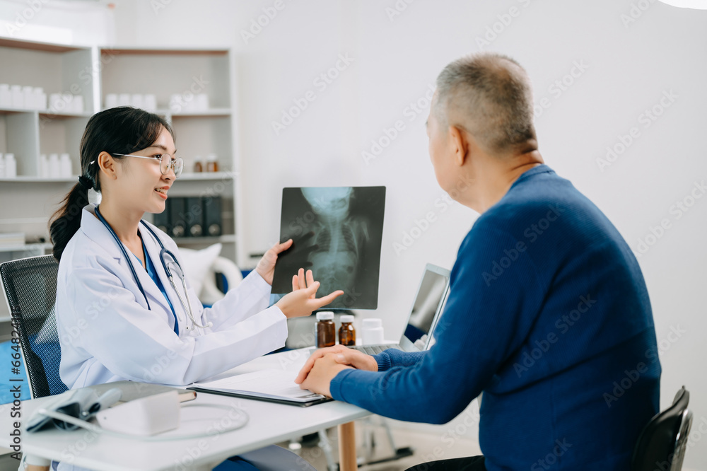 Fototapeta premium Serious Asia female doctor using clipboard is delivering great news talk discuss results or symptoms with female patient in clinic or hospital .