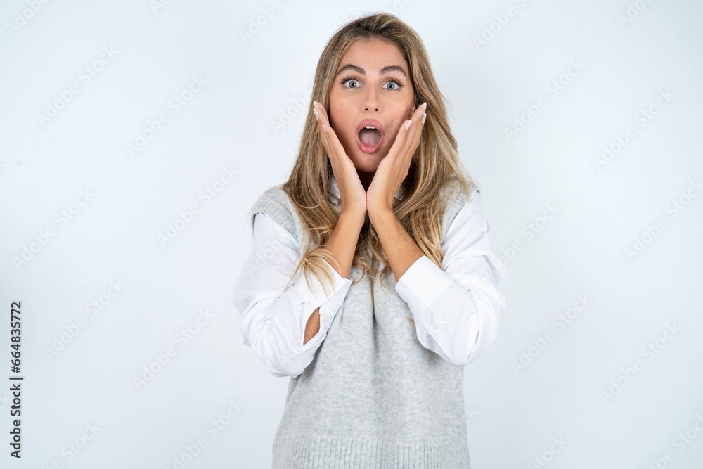 Surprised terrified Young beautiful woman Gestures with uncertainty, stares at camera, puzzled as doesn't know answer on tricky question, People, body language, emotions concept Surprised terrified Young beautiful woman Gestures with uncertainty, stares at camera, puzzled as doesn't know answer on tricky question, People, body language, emotions concept