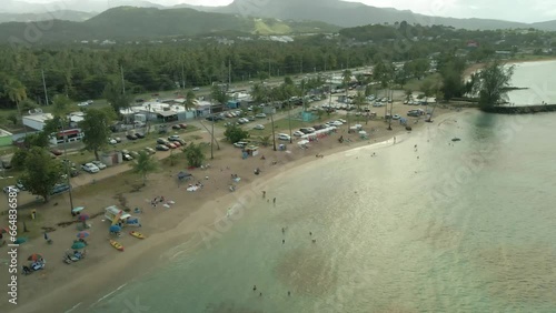 Luquillo Puerto rico kiosko de luquillo playa fortuna  shoreline perallel fly over sunset cloudy 4K60P. photo