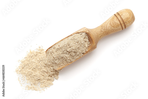 Organic Multi-Grain Flour in a wooden scoop, isolated on a white background. Top view.
