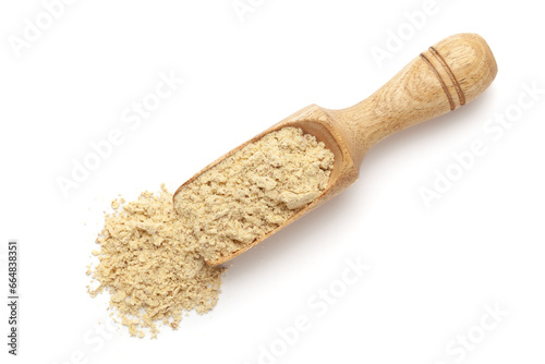 Organic Gram Flour (Cicer arietinum) or Besan in a wooden scoop, isolated on a white background. Top view.