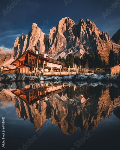 Dolomites Mountains with beautiful Reflection in a Lake at Geisler Alm in South Tyrol