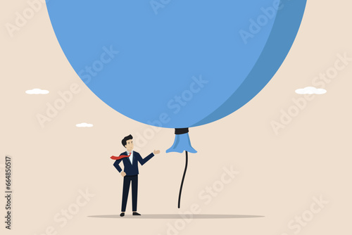 Stock market, cryptocurrency bitcoin bubble, speculation investment risk,big debt concept, scared businessman investor standing under big big hot air balloon bubble.