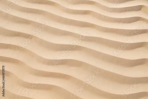 Closeup of sand pattern of a beach in the summer.