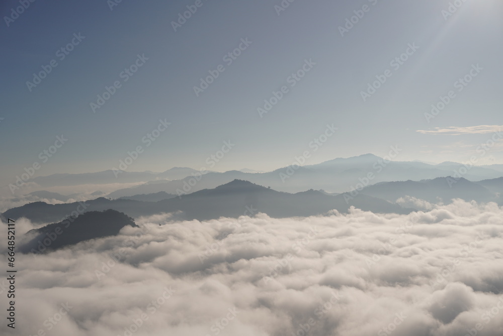 sky background ,The sea of ​​fog covers the mountain peaks.