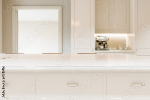 Kitchen white countertop with white marble  with blurred bokeh background. 