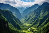 verdant valley surrounded by steep mountains