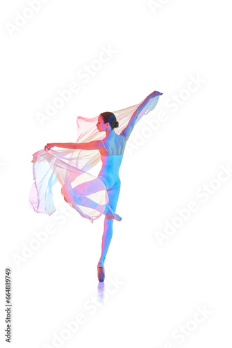Slim, elegant young woman, ballerina ion bodysuit dancing with transparent fabric isolated on white studio background in neon light. Concept of beauty, classical dance, art, elegance, choreography