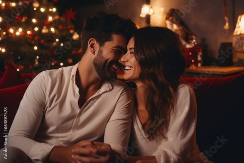 Loved couple enjoying Christmas holidays together at home. © PRASANNAPIX