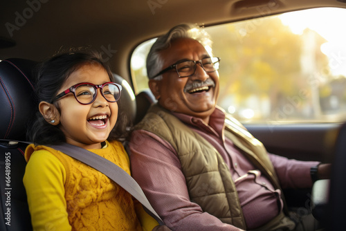 indian grandfather and granddaughter driving car © PRASANNAPIX