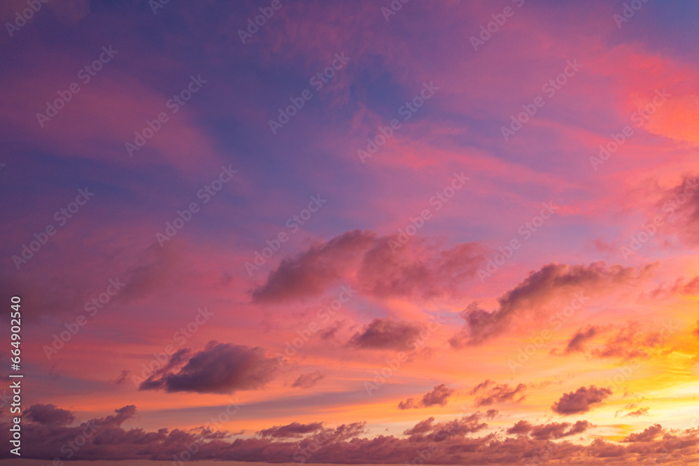 exotic pink red sky in sunset at Karon beach Phuket..Scene of colorful romantic sky sunset with changing the brilliant yellow sky gradually turned red. .beautiful sky of sunset in nature and travel 