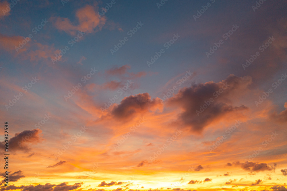Fototapeta premium exotic pink red sky in sunset at Karon beach Phuket..Scene of colorful romantic sky sunset with changing the brilliant yellow sky gradually turned red. .beautiful sky of sunset in nature and travel 