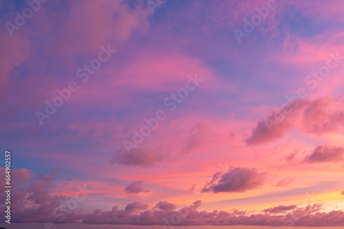 exotic pink red sky in sunset at Karon beach Phuket..Scene of colorful romantic sky sunset with changing the brilliant yellow sky gradually turned red. .beautiful sky of sunset in nature 