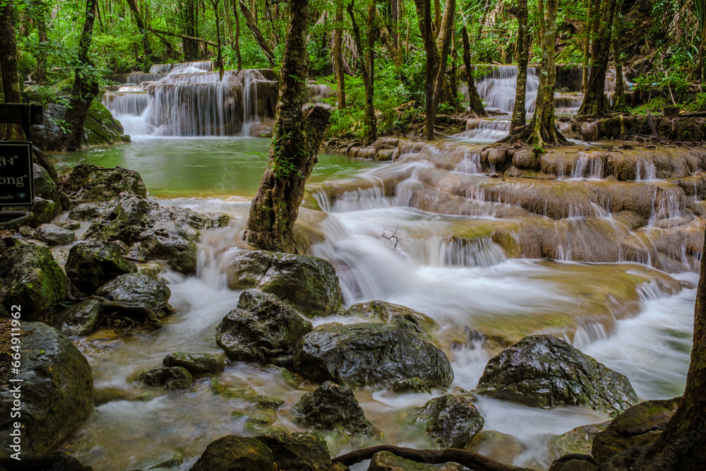 Fototapeta premium Erawan Waterfall Thailand during rain season, a beautiful deep forest waterfall in Thailand. Erawan Waterfall in National Park