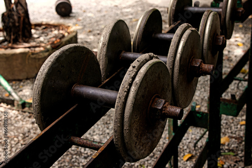 street gym, old, old dumbbells on the ground. Sports equipment for bodybuilding and training.