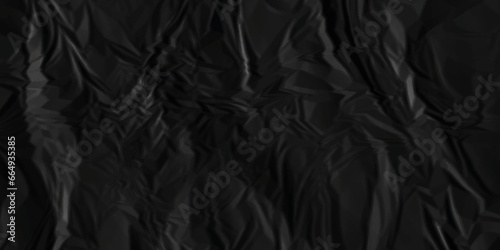 Dark black crumpled paper texture background. black crumpled and top view textures can be used for background of text or any contents.  