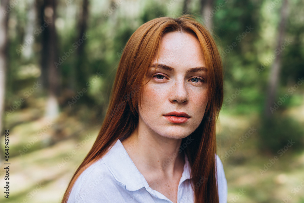 Beautiful woman natural face freckles casual female portrait lifestyle beauty girl. Outdoor girl portrait in green summer forest Beautiful woman natural face freckles casual female portrait lifestyle beauty girl. Outdoor girl portrait in green summer forest