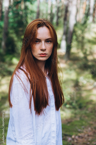 Beautiful woman natural face freckles casual female portrait lifestyle beauty girl. Outdoor girl portrait in green summer forest