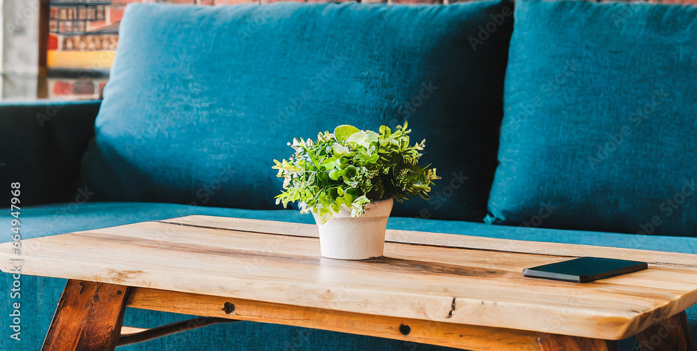 Obraz na płótnie rustic coffee table near blue sofa against brick wall farmhouse home interior design of mode  w salonie