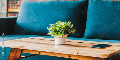rustic coffee table near blue sofa against brick wall farmhouse home interior design of mode 