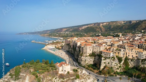 Fototapeta Naklejka Na Ścianę i Meble -  Tropea - Italy - Aerial view of the coast of Tropea in the summer season to the beach between the old town and the castle, Calabria