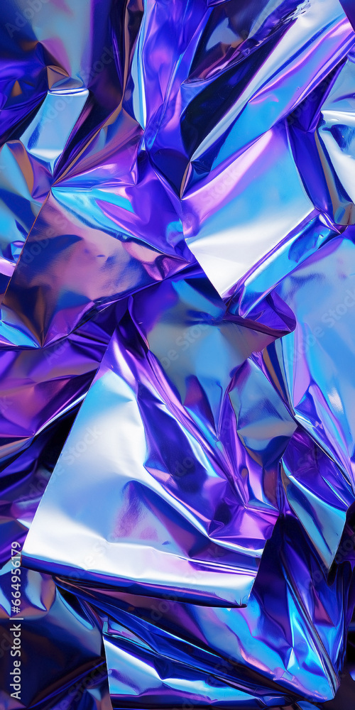 Silver, purple and dark blue iridescent holographic surface shining. Futuristic twisted and crumpled aluminum foil made of liquid metal with color gradients.