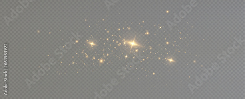 Golden sequins glow with many lights. Glittering dust. Luxurious background of golden particles.	