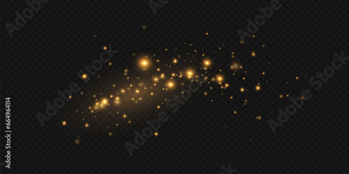 Golden sequins glow with many lights. Glittering dust. Luxurious background of golden particles.	