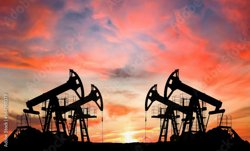 Oil prices on global market. Crude oil Pumpjack on oilfield on sunset. Fossil crude production. Oil drill rig and drilling derrick. Global crude oil Prices, petroleum demand OPEC+. Pump jack, oilfield