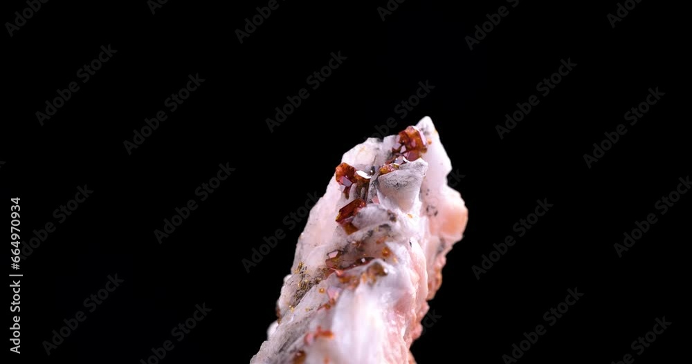 orange vanadinite on baryte rotating 360° in 4k isolated on black background. macro detail close-up rough raw unpolished semi-precious gemstone.
orange vanadinite on baryte rotating 360° in 4k isolated on black background. macro detail close-up rough raw unpolished semi-precious gemstone.