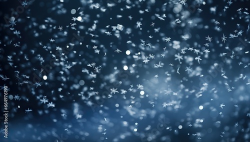 Falling snowflakes on a dark background. © volga