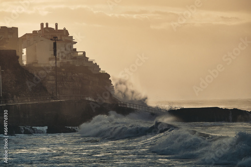 Waves crashing into the town