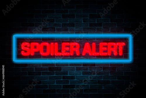 Spoiler Alert neon banner on brick wall background.