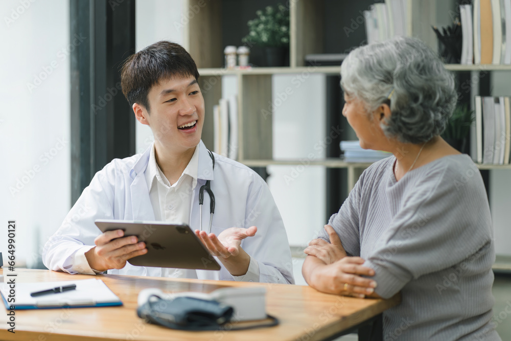Young male doctor explaining diagnosis to senior woman patient about test results. Young male doctor explaining diagnosis to senior woman patient about test results.