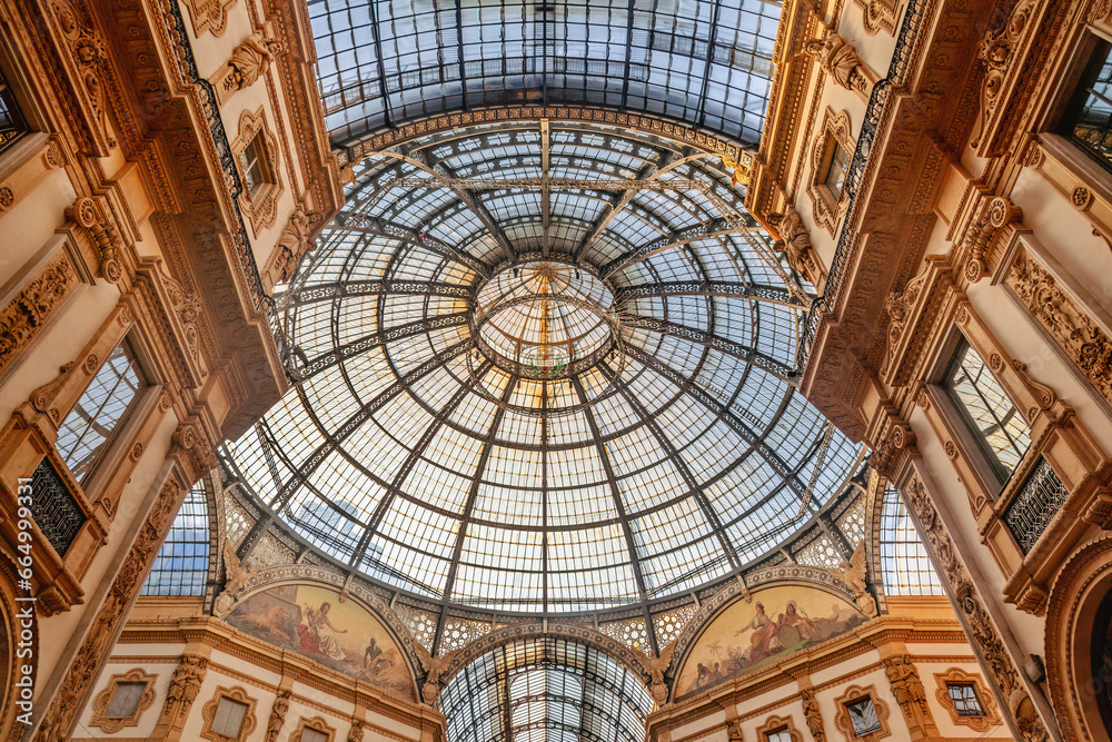 Glass dome inside the Galleria Vittorio Emanuele II in Milan. This gallery is one of the world's oldest shopping malls, completed in 1877, a true masterpiece of architecture Glass dome inside the Galleria Vittorio Emanuele II in Milan. This gallery is one of the world's oldest shopping malls, completed in 1877, a true masterpiece of architecture
