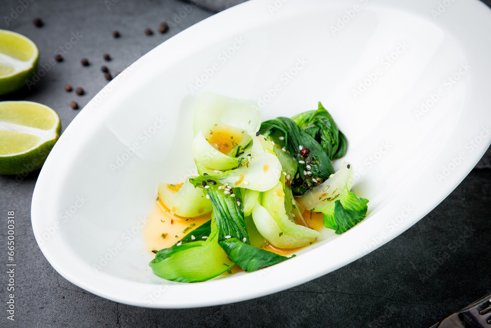 a dish of eggs and seaweed with sesame seeds and lime on the background in a beautiful plate side view a dish of eggs and seaweed with sesame seeds and lime on the background in a beautiful plate side view