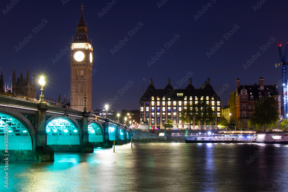 Fototapeta premium Big Ben, Parliament, and Westminster bridge on River Thames at night, in London, the UK