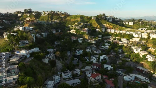 Drone flying towards luxurious mansions on Hollywood Hills in Los Angeles. luxury residences and villas in Hollywood Hills. 