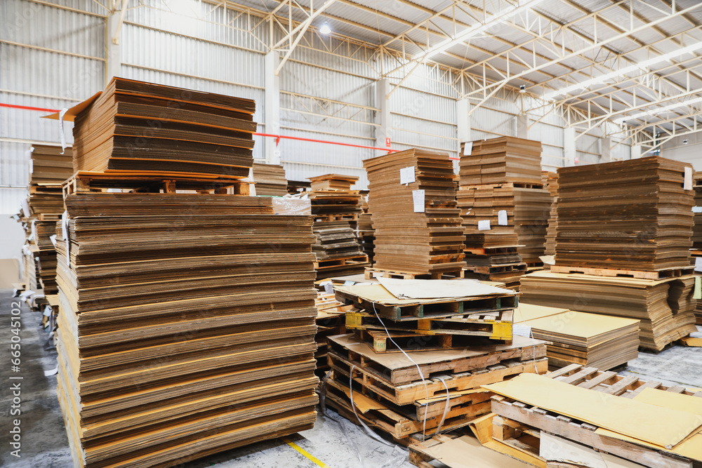 Stacks of cardboard, ready-made box products, packages on pallets inside warehouses, production and export facilities, modern logistics with secure systems. Stacks of cardboard, ready-made box products, packages on pallets inside warehouses, production and export facilities, modern logistics with secure systems.