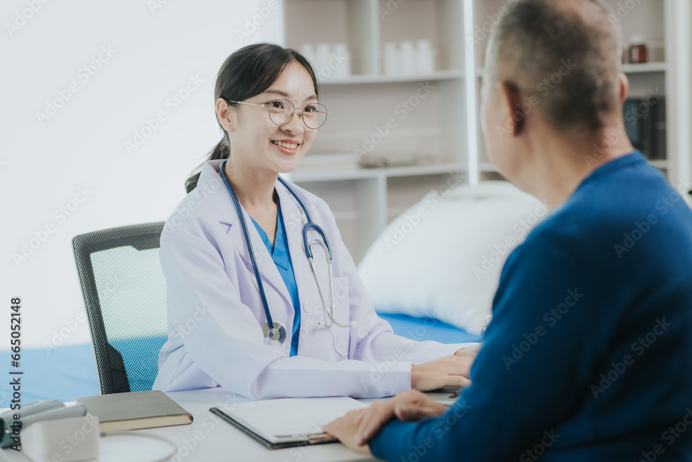 Professional female doctor smiles and shows positive test results to elderly male patient at doctor's appointment in modern office of medical institution Professional female doctor smiles and shows positive test results to elderly male patient at doctor's appointment in modern office of medical institution