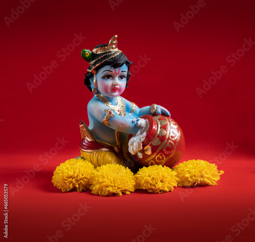 Hindu God Krishna on red background indian dahi handi festival