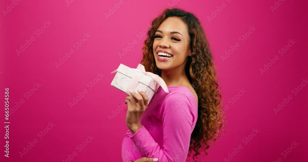 Beautiful young woman poses with gift box pink studio, Valentines or anniversary Beautiful young woman poses with gift box pink studio, Valentines or anniversary