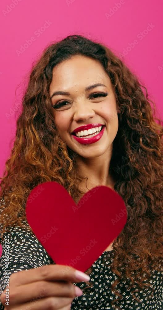 Cute multi-ethnic woman poses with paper hearts, symbol of love studio Valentine Cute multi-ethnic woman poses with paper hearts, symbol of love studio Valentine